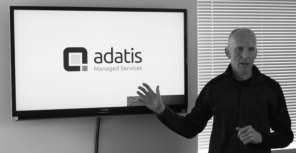 A man presenting Managed Services presentation