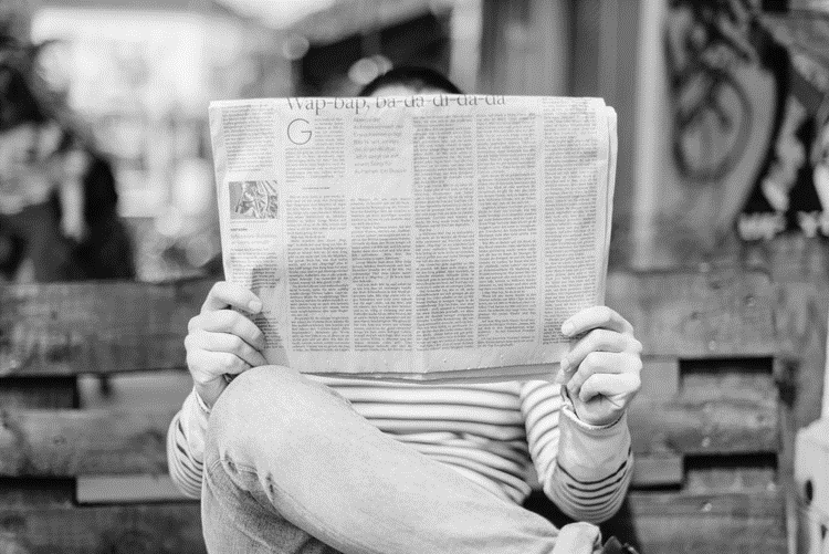 a man reading a newspaper