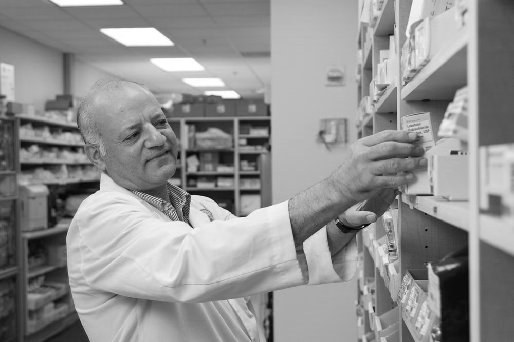 a man working in a chemist